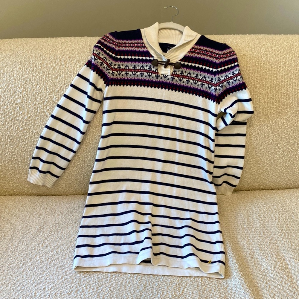 Nautical sweater dress with stripes and patterns.